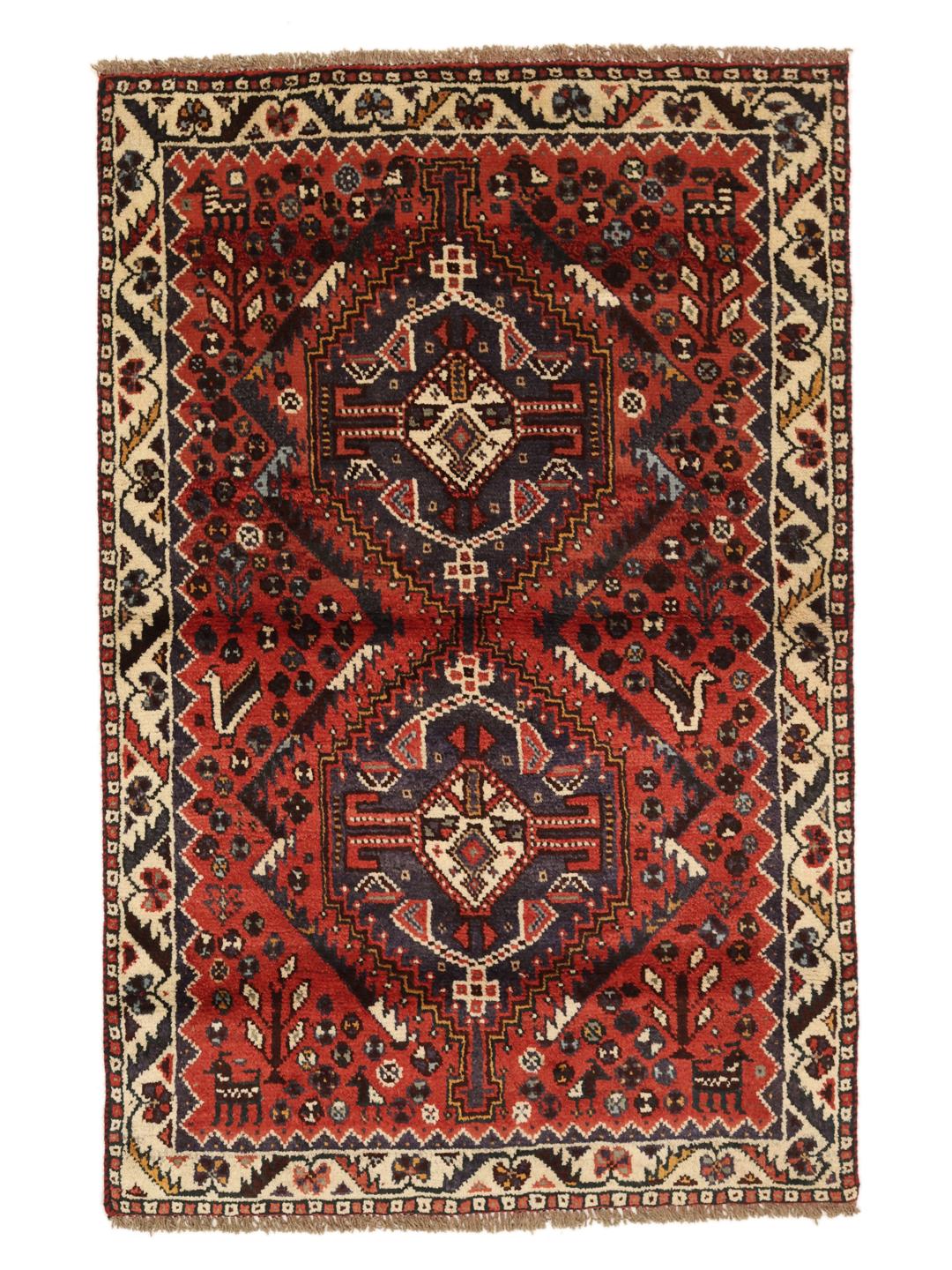 Hand-knotted Shiraz rug from the Middle East featuring a vibrant red field and geometric patterns.