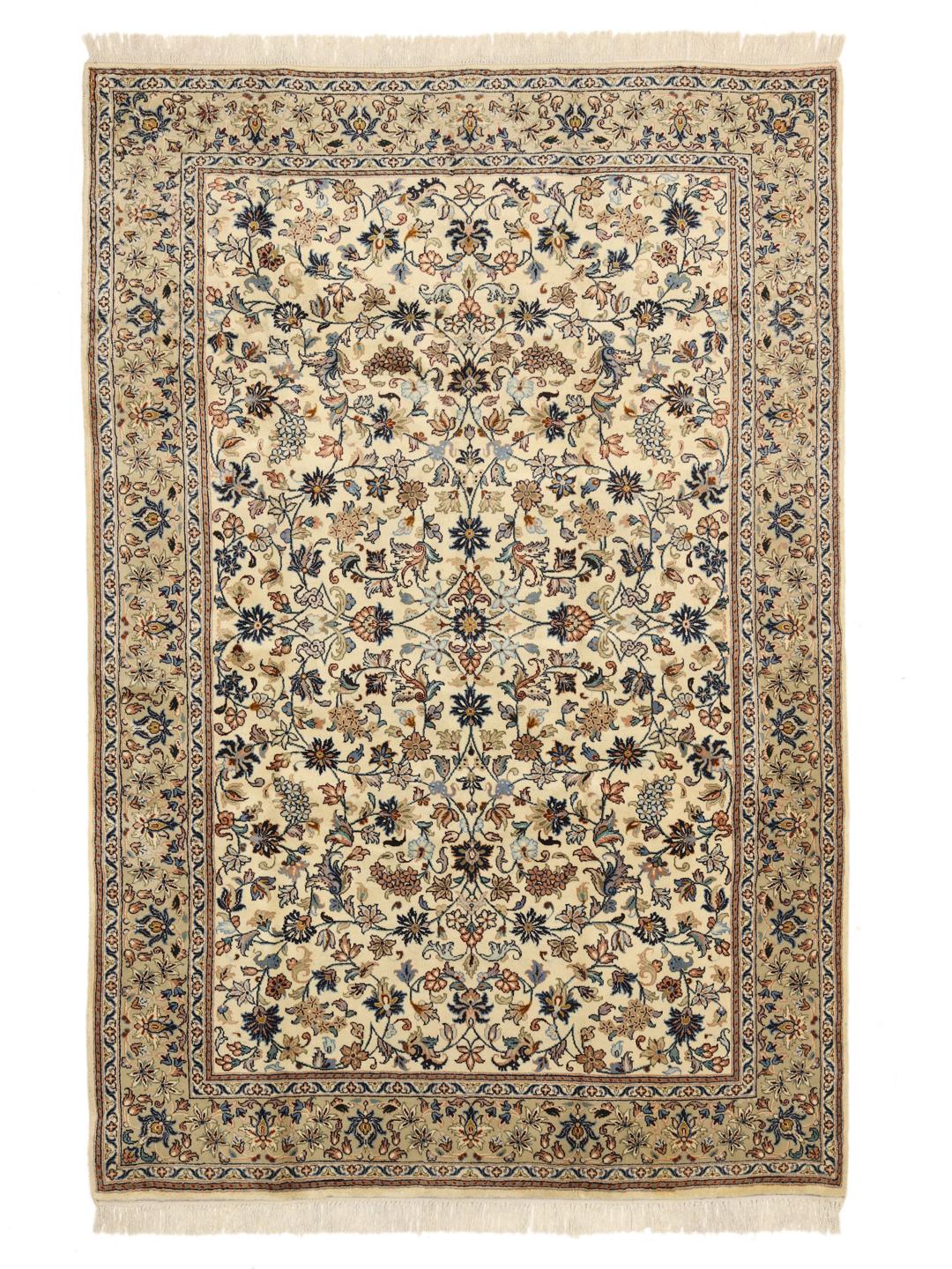 A hand-knotted Keshan rug from the Middle East with a beige field and floral patterns.