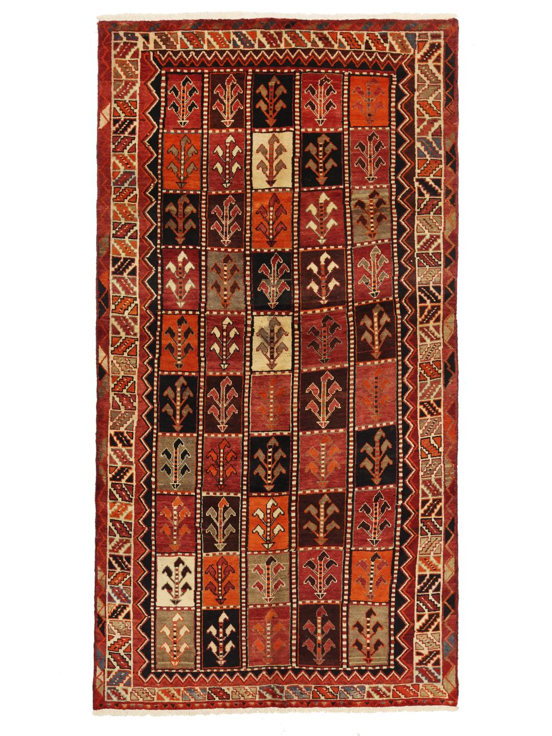 A hand-knotted Qashqai rug from the Middle East featuring a vibrant red field with geometric floral motifs.