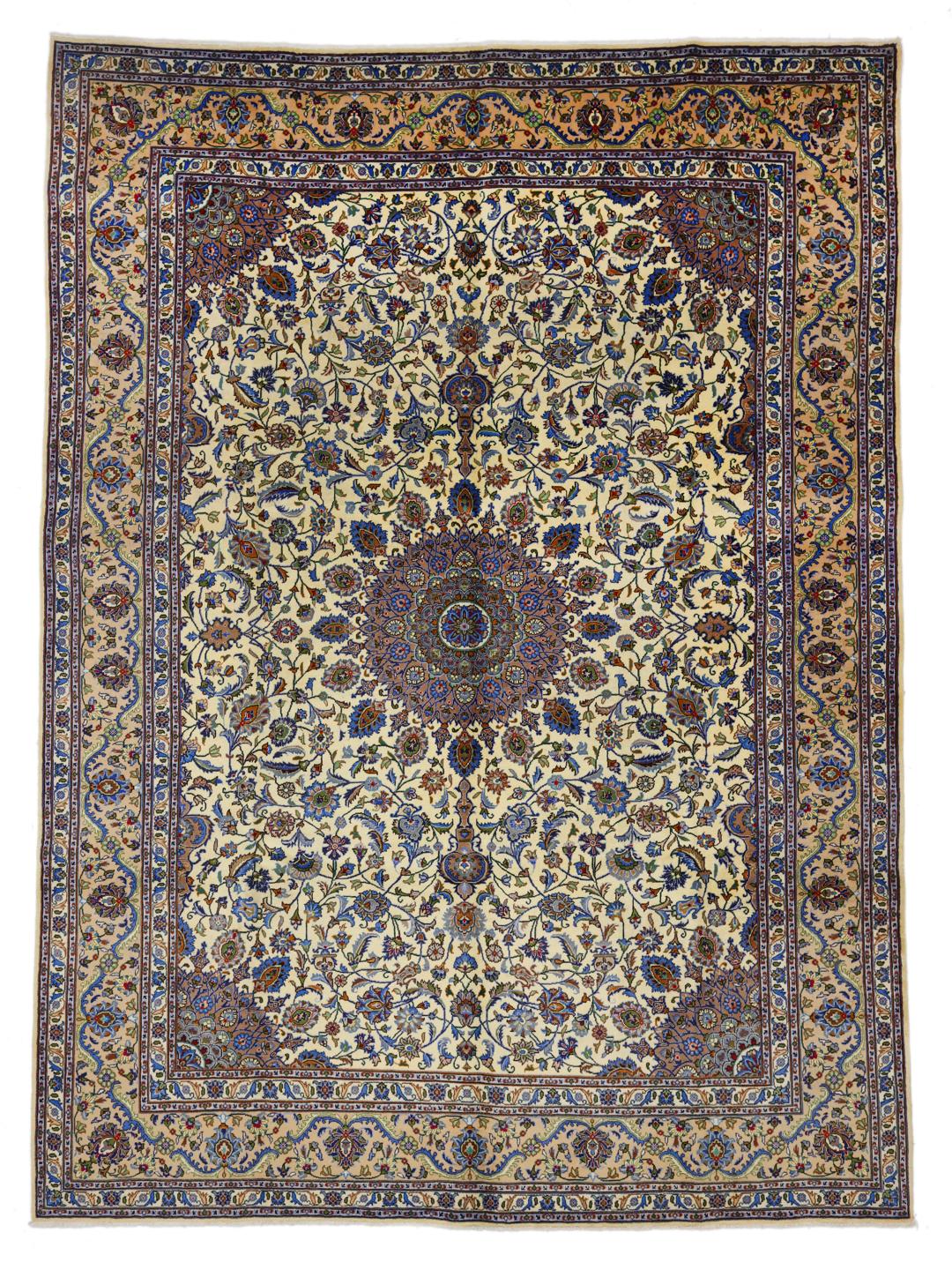 A large hand-knotted beige Mashad rug from the Middle East with intricate floral patterns.