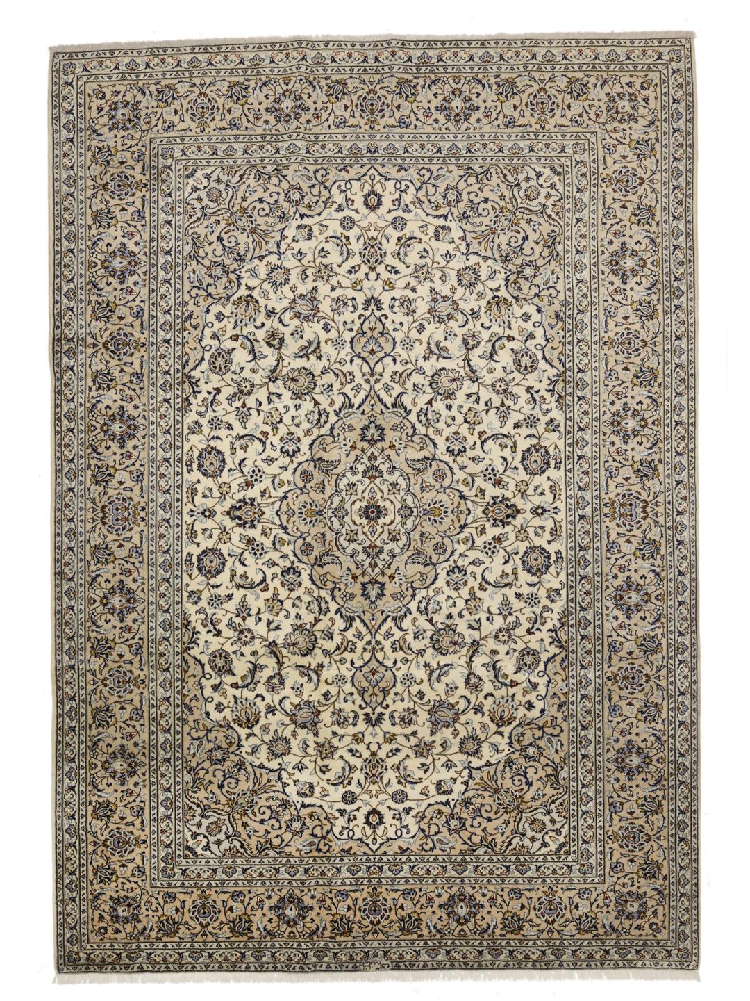 A hand-knotted Keshan rug from the Middle East with a cream background and floral motifs.