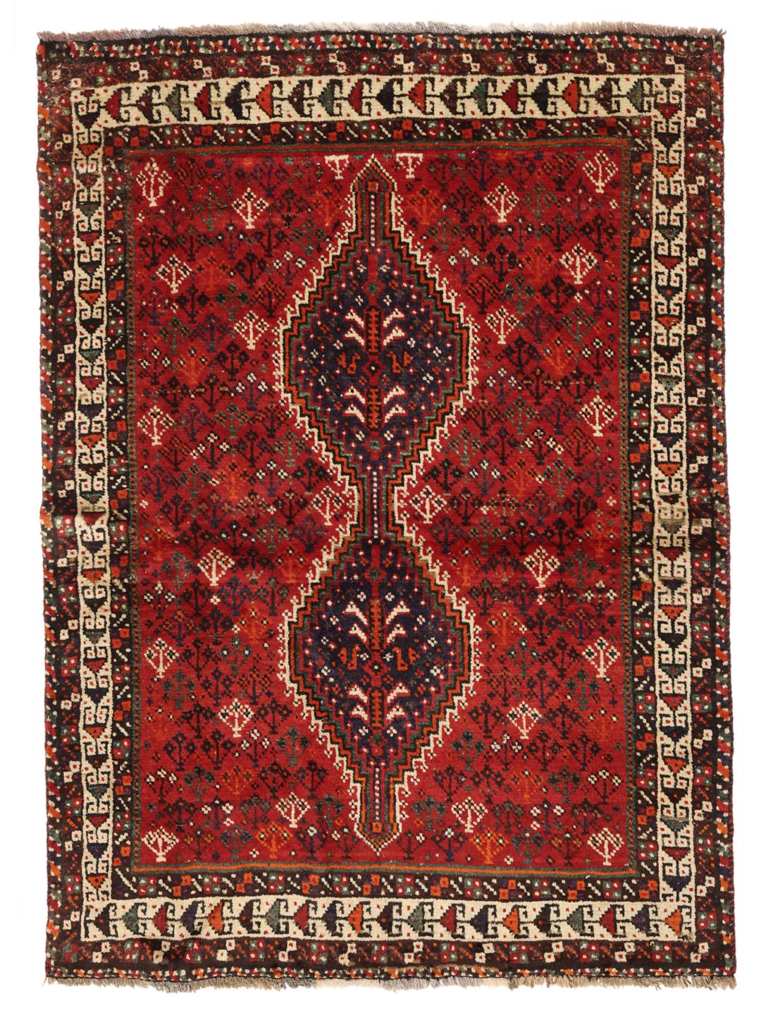A hand-knotted Shiraz rug from the Middle East in deep red with geometric patterns.