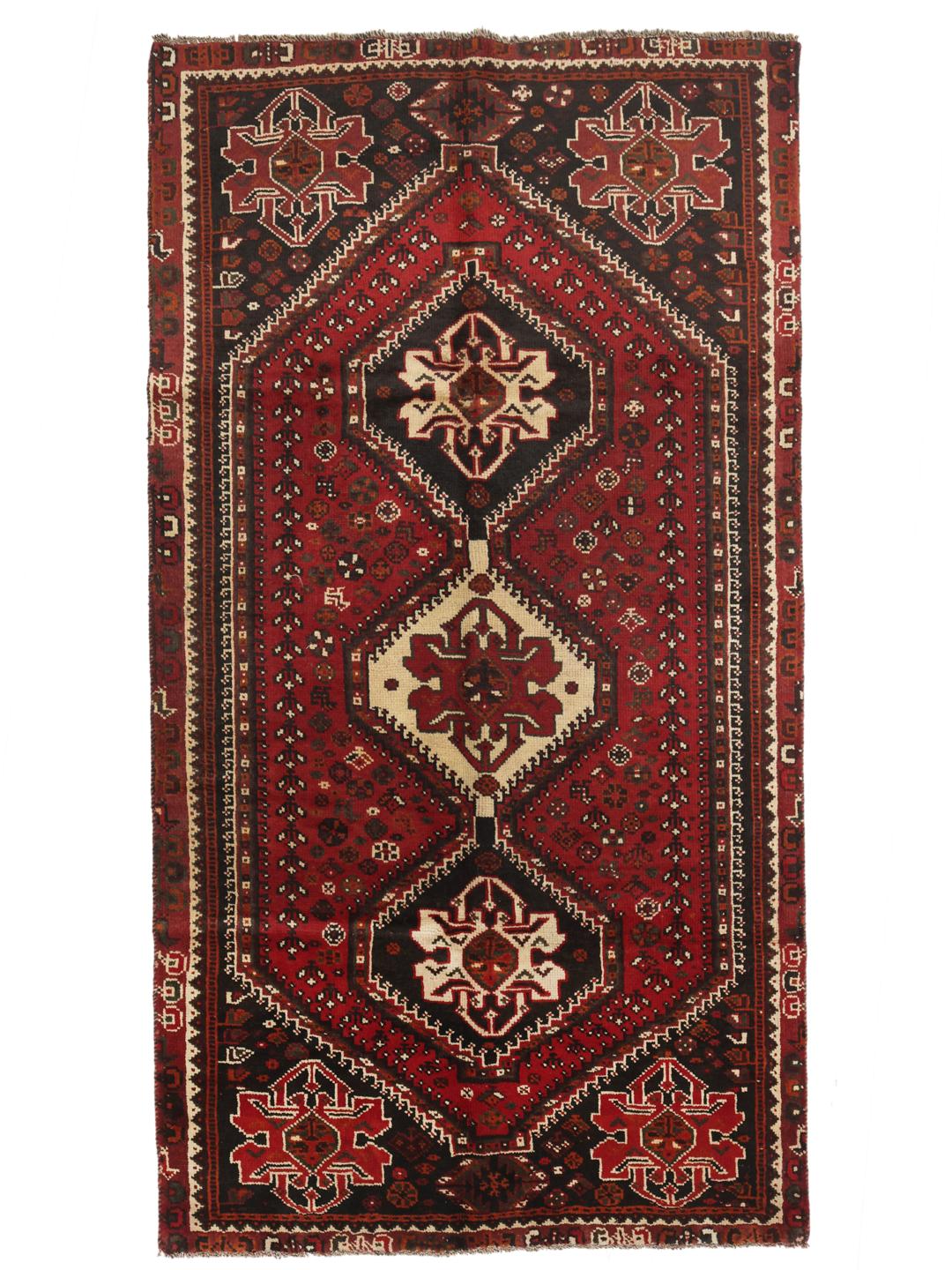 Authentic hand-knotted Ghashghai rug with red and black wool geometric patterns from the Middle East.