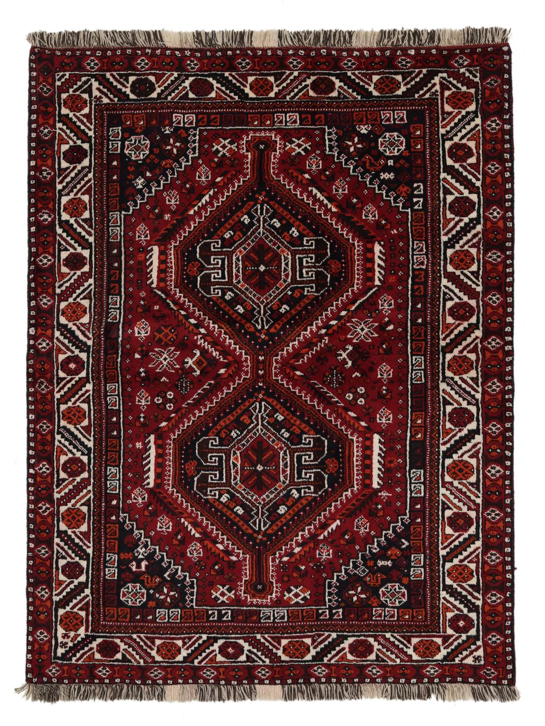 Hand-knotted Middle Eastern rug in dark-red with geometric medallion patterns