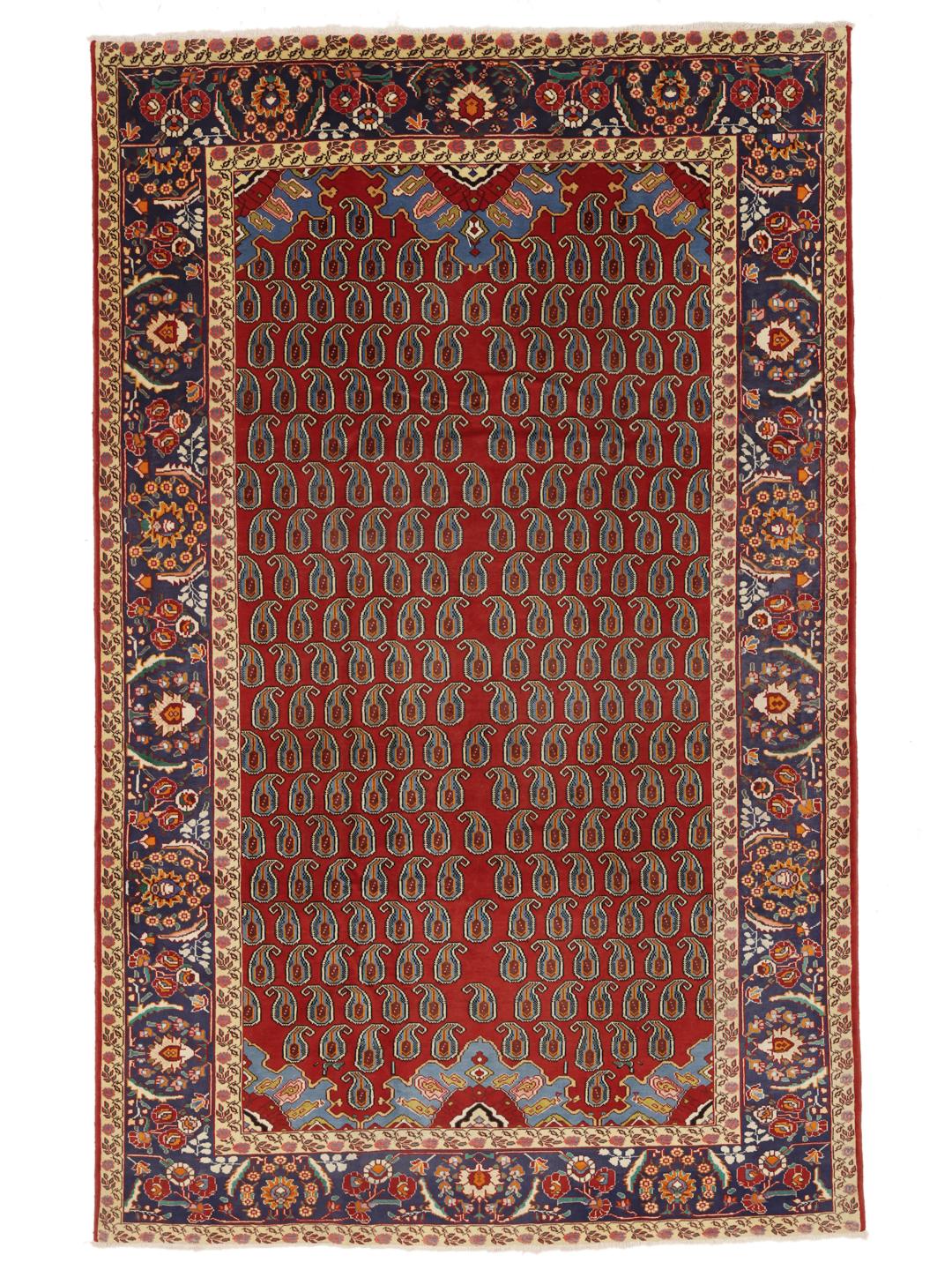 A hand-knotted Tabriz rug from the Middle East with a red field and boteh pattern