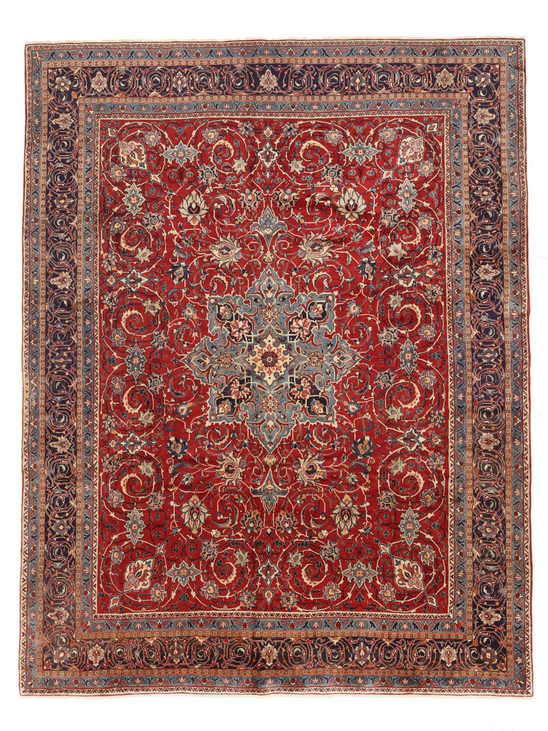 A hand-knotted Sarough rug from the Middle East featuring a vibrant red field with blue floral accents.