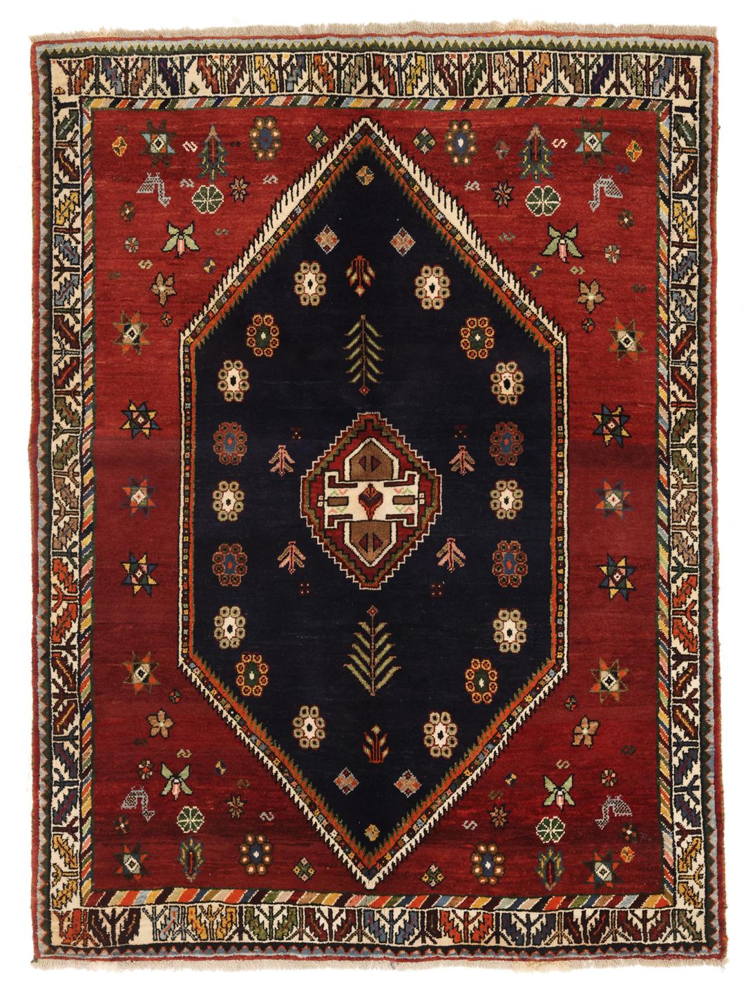 Hand-knotted Ghashghai rug from the Middle East featuring a red and dark blue colour palette