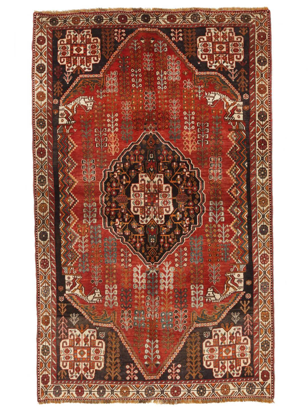 Hand-knotted Ghashghai rug from the Middle East featuring a red and black tribal pattern.