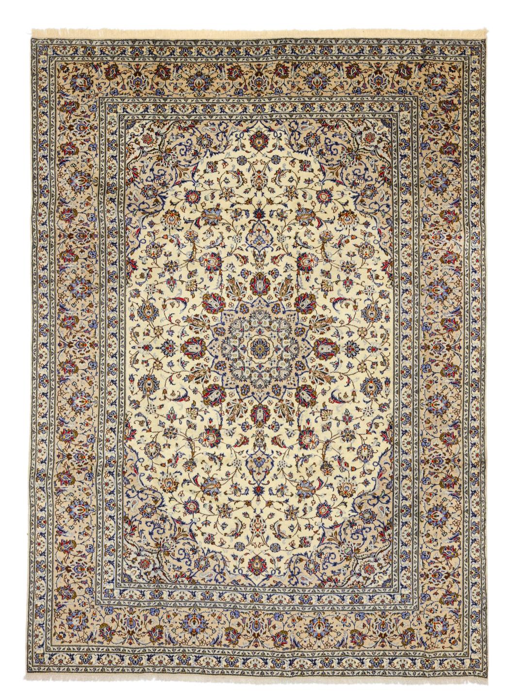 A large rectangular Keshan rug with a beige field and intricate floral medallion from the Middle East.