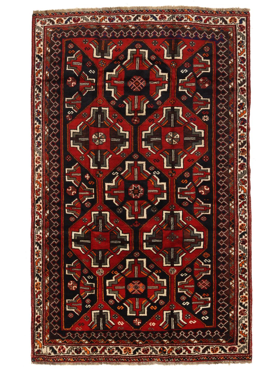 A hand-knotted Shiraz rug from the Middle East in deep red and black tones with geometric patterns.