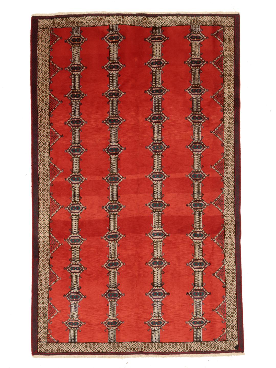 A hand-knotted Shiraz rug from the Middle East featuring a red field with geometric motifs.