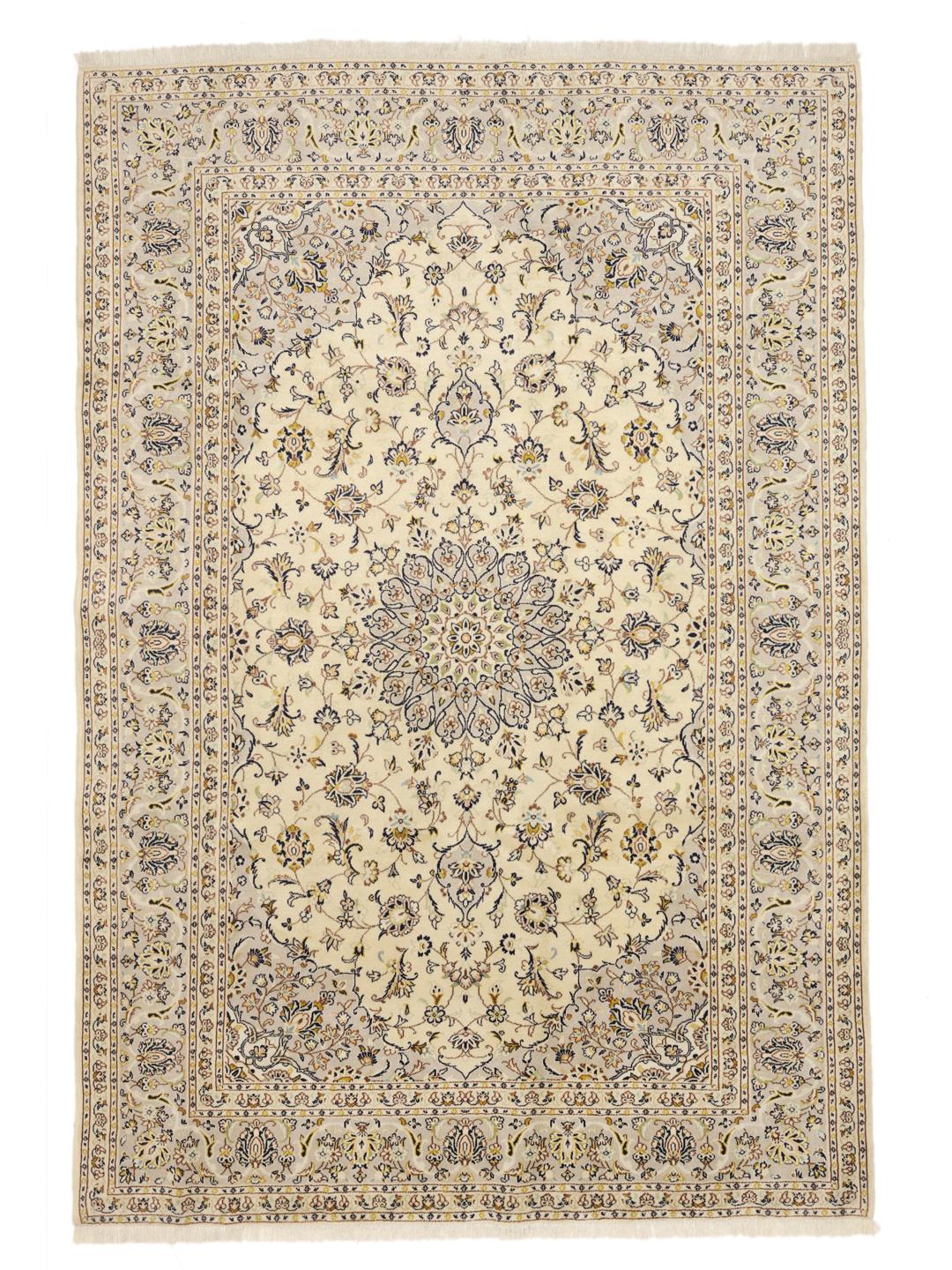A hand-knotted Keshan rug from the Middle East featuring a beige field with floral patterns.