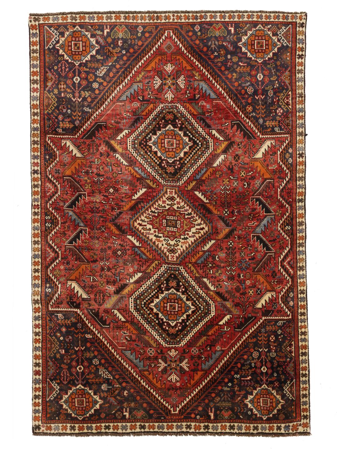 Hand-knotted Ghashghai rug with red and blue tribal geometric patterns from the Middle East