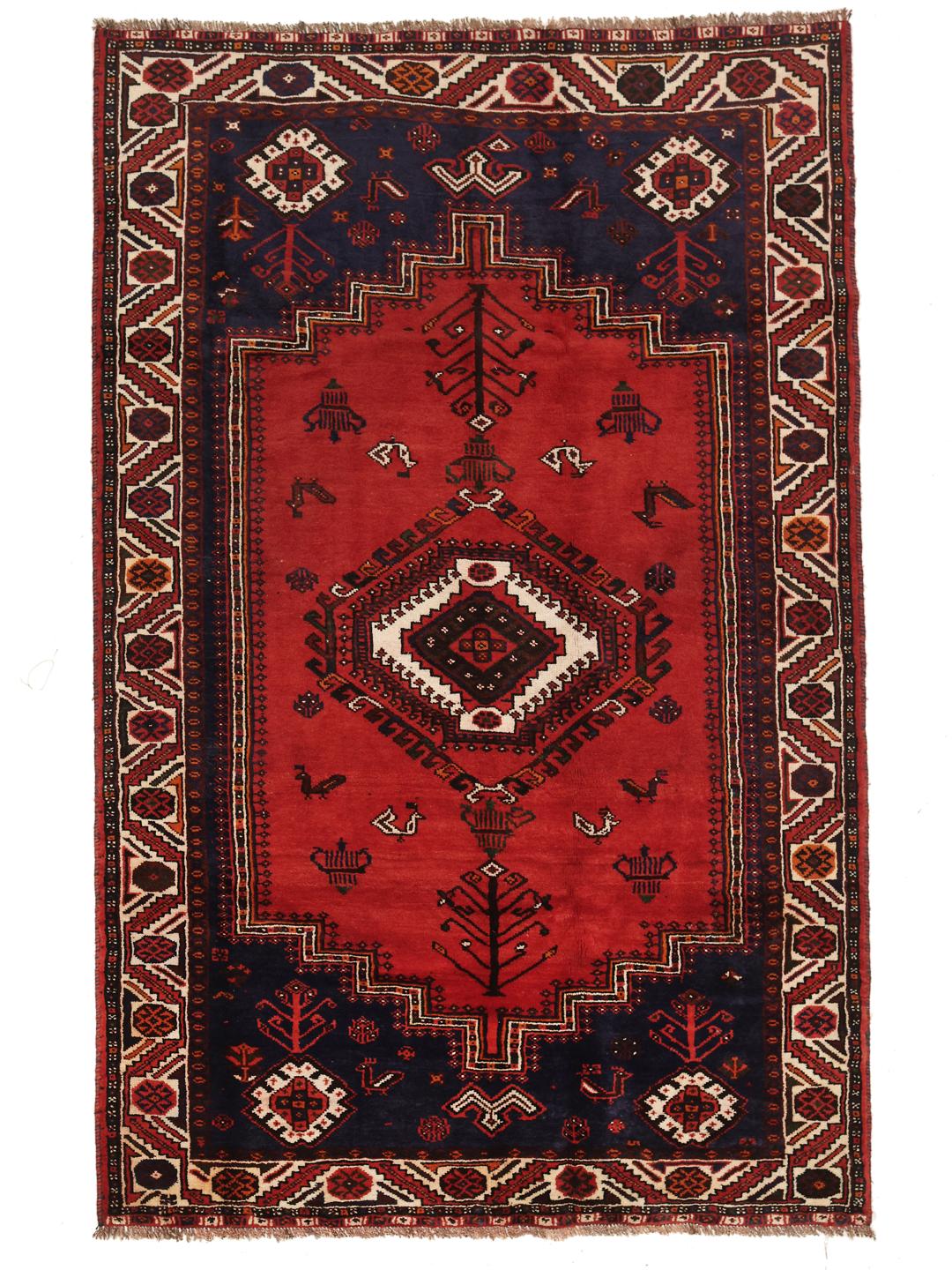 Hand-knotted Ghashghai rug with red and blue tribal patterns from the Middle East
