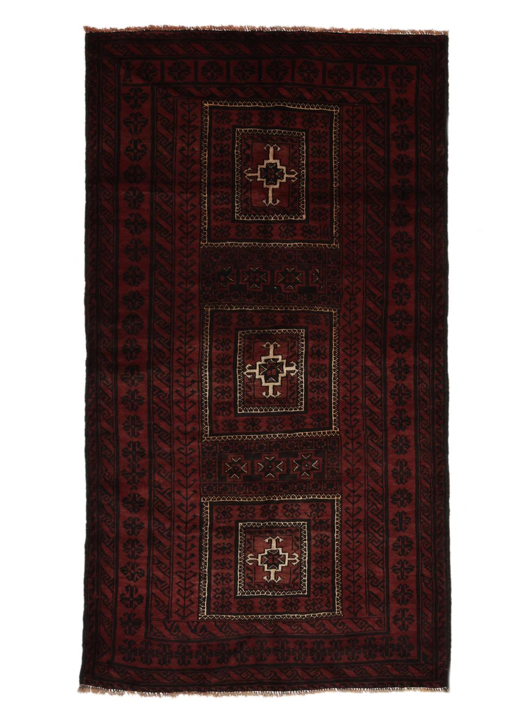 A hand-knotted Middle Eastern Beluch rug in deep red and black tones with geometric patterns.
