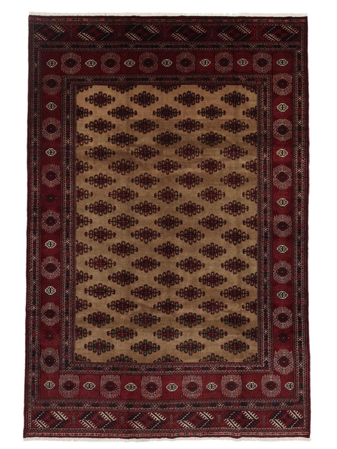 Hand-knotted Turkaman rug from the Middle East in deep red and beige tones.