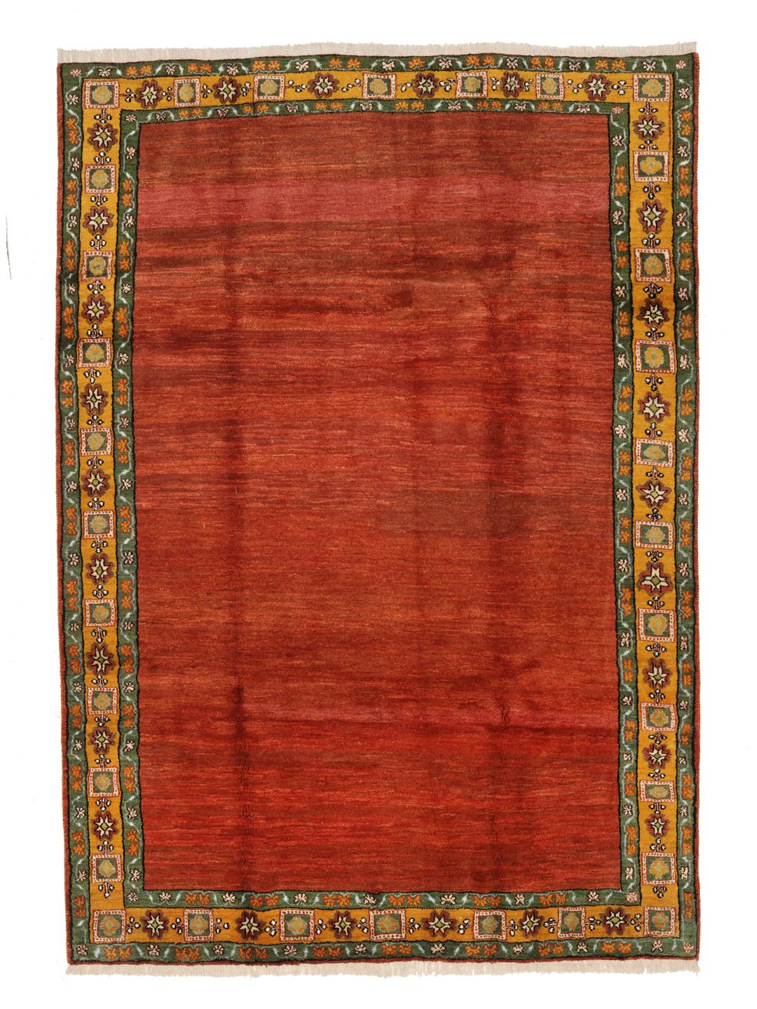 Hand-knotted Gabbeh rug with a red field and decorative border from the Middle East
