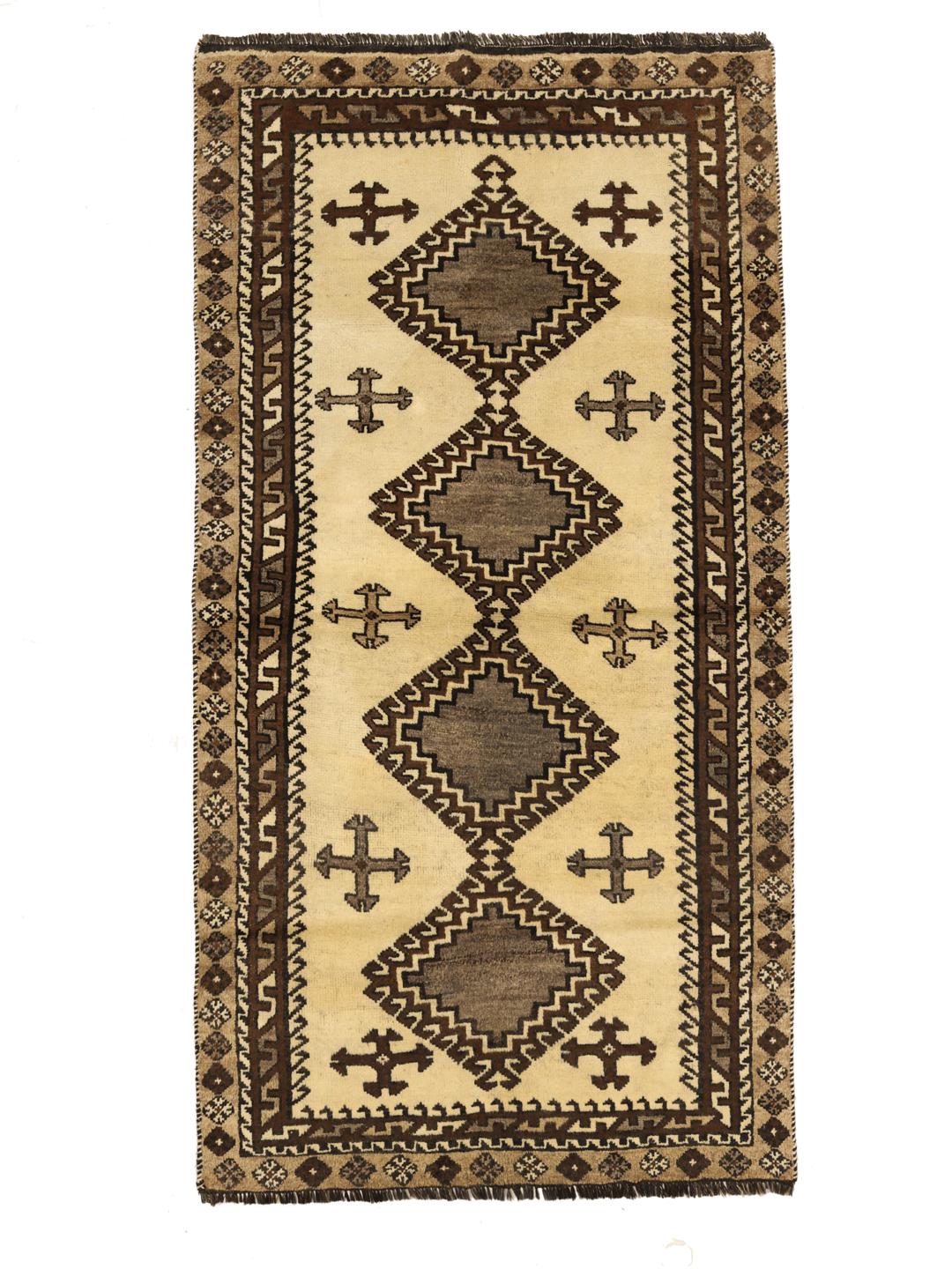A hand-knotted Shiraz rug from the Middle East featuring geometric patterns in brown and beige.
