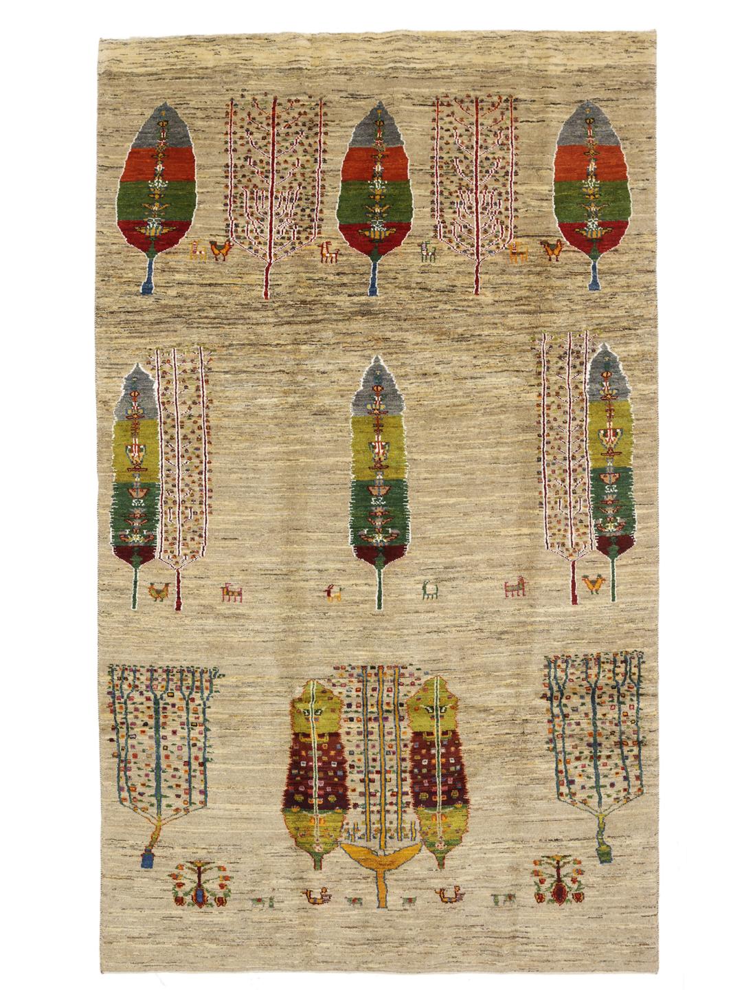 Hand-knotted Gabbeh rug from the Middle East featuring tree motifs in beige and multicolor wool.
