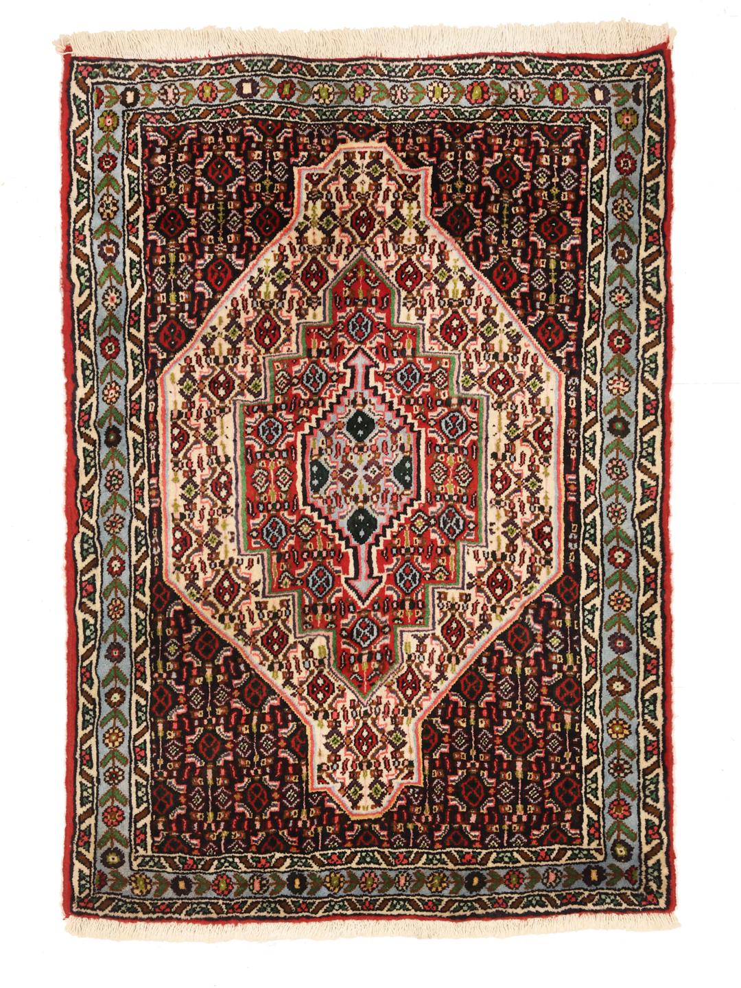Hand-knotted Senneh rug from the Middle East featuring a vibrant multicolor geometric pattern