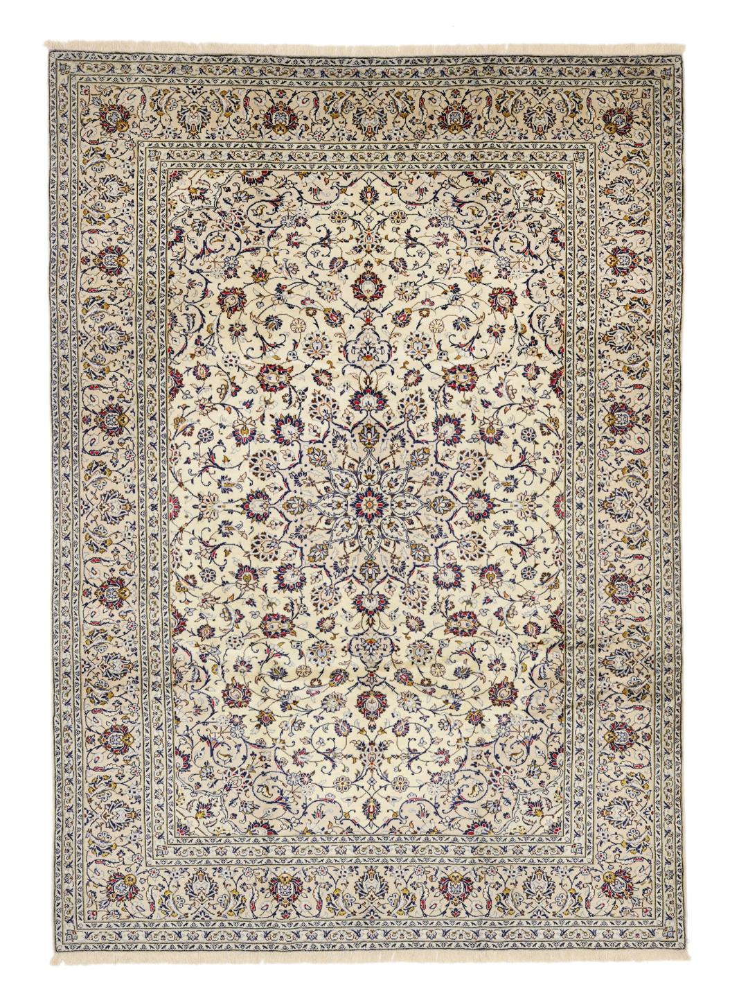 A large hand-knotted Keshan rug from the Middle East in beige with floral patterns.