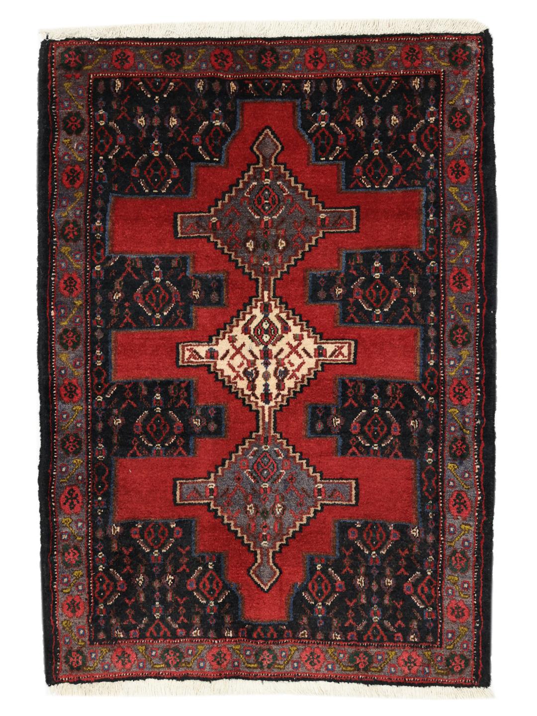 Hand-knotted Senneh rug from the Middle East in red and black