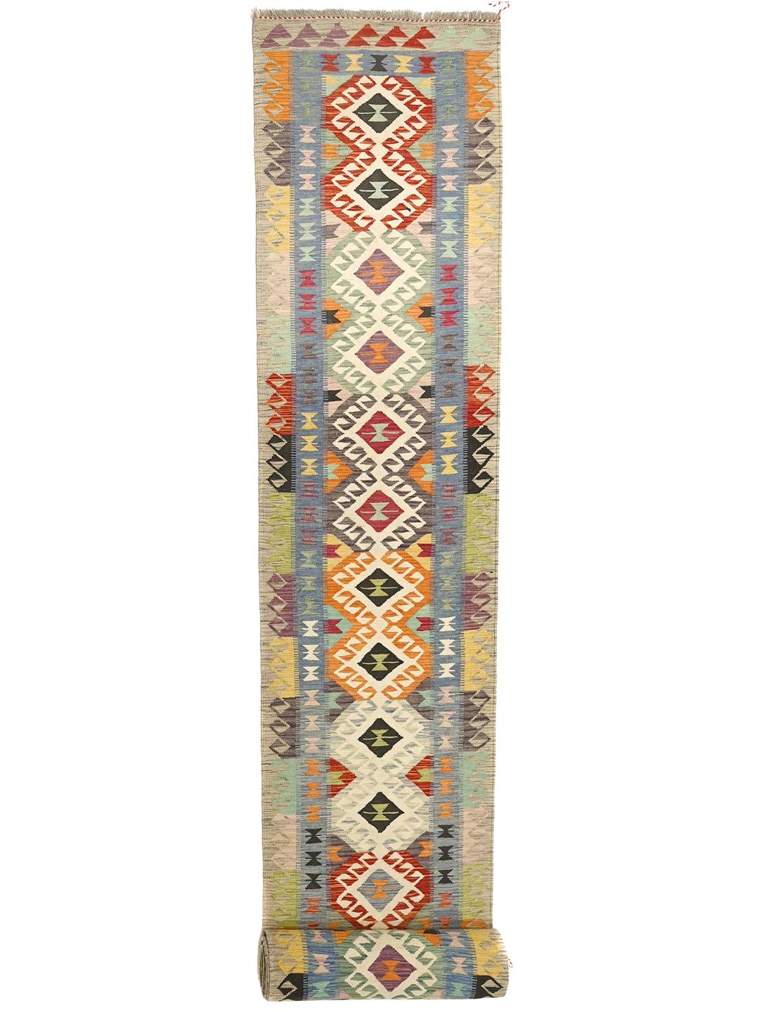 Hand-woven Afghan runner with vibrant geometric patterns in multicolor wool