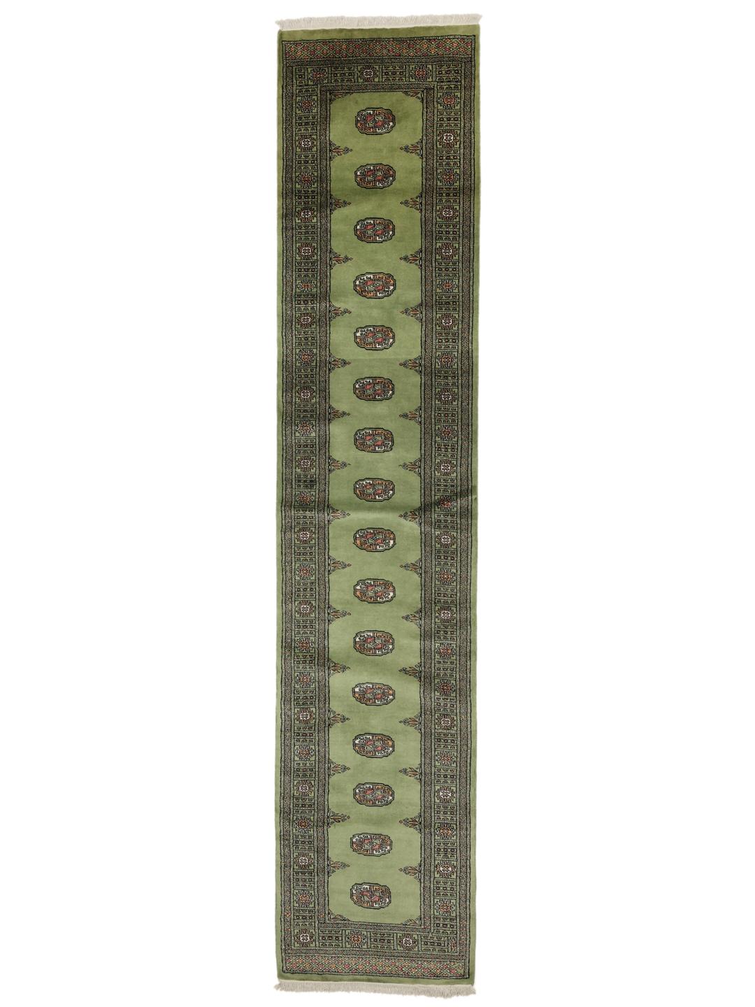 Hand-knotted Pakistan Bokhara runner in green with traditional geometric motifs.
