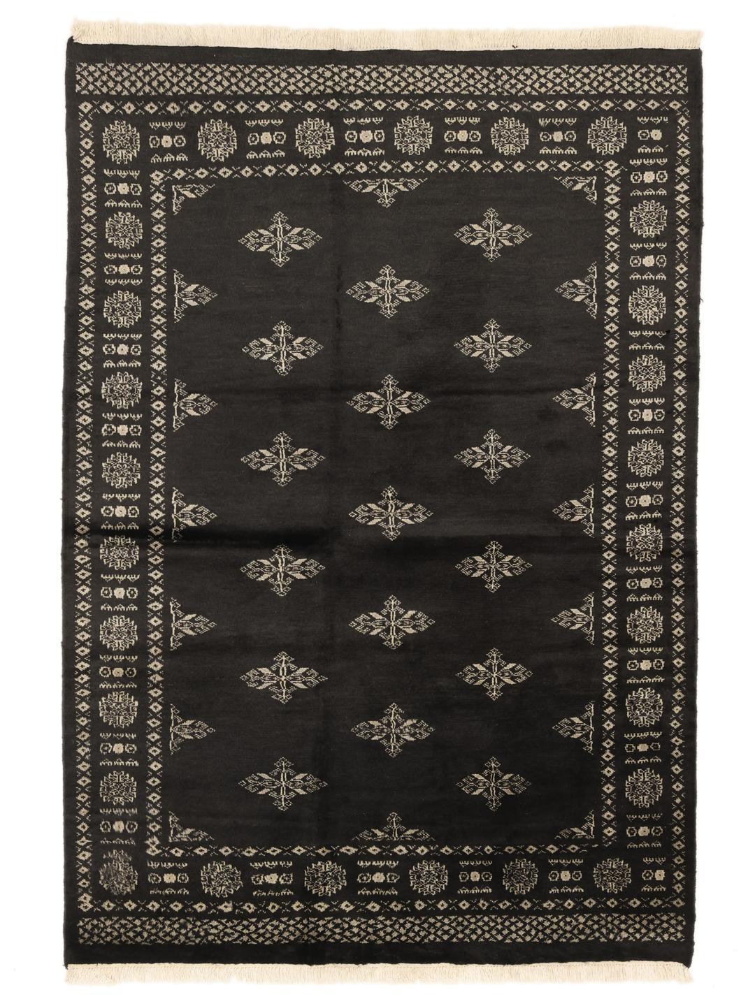 Hand-knotted Pakistani rug in black with repeating geometric motifs