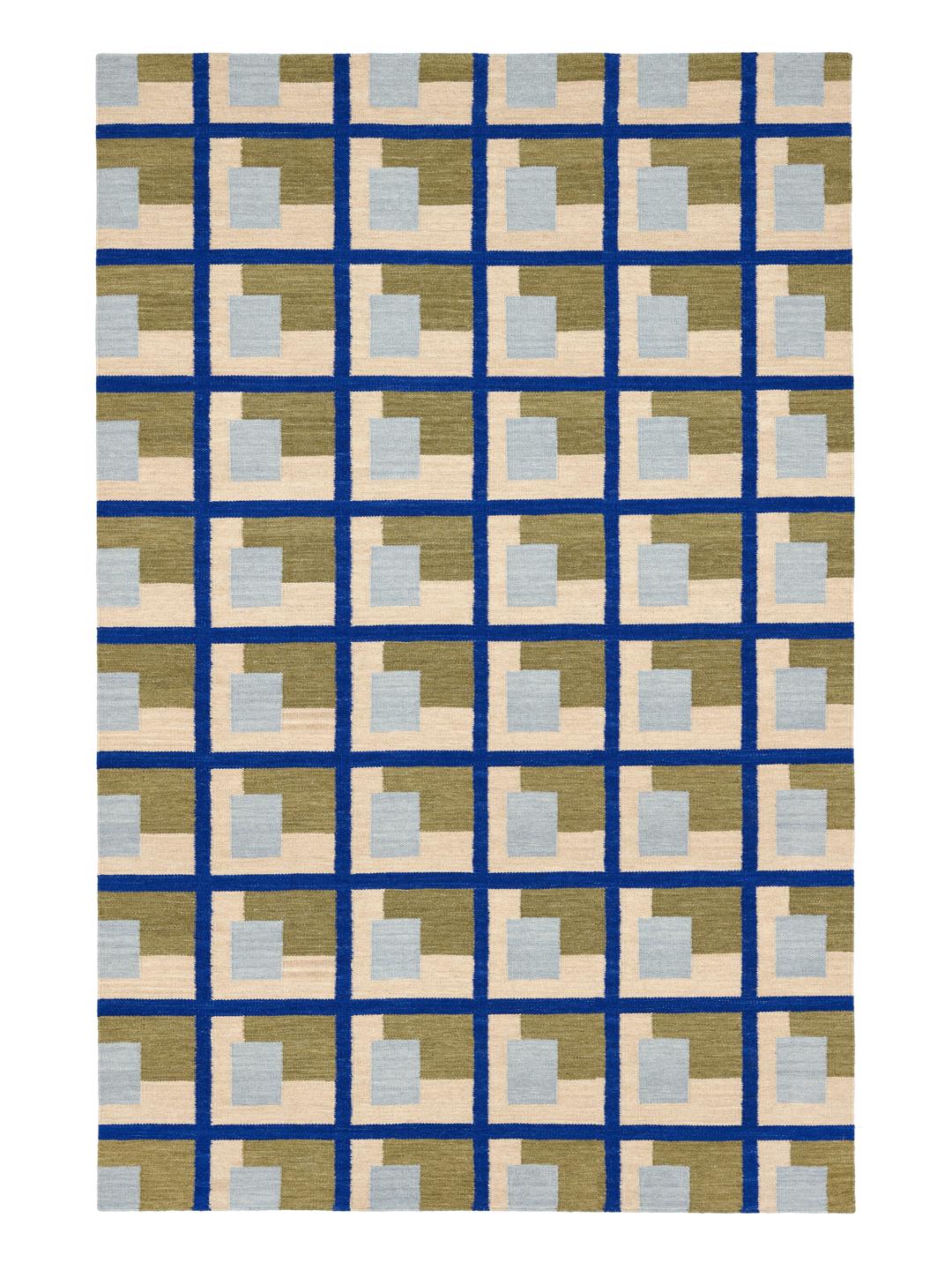 Een handgeweven groen vloerkleed met een geometrisch rasterpatroon