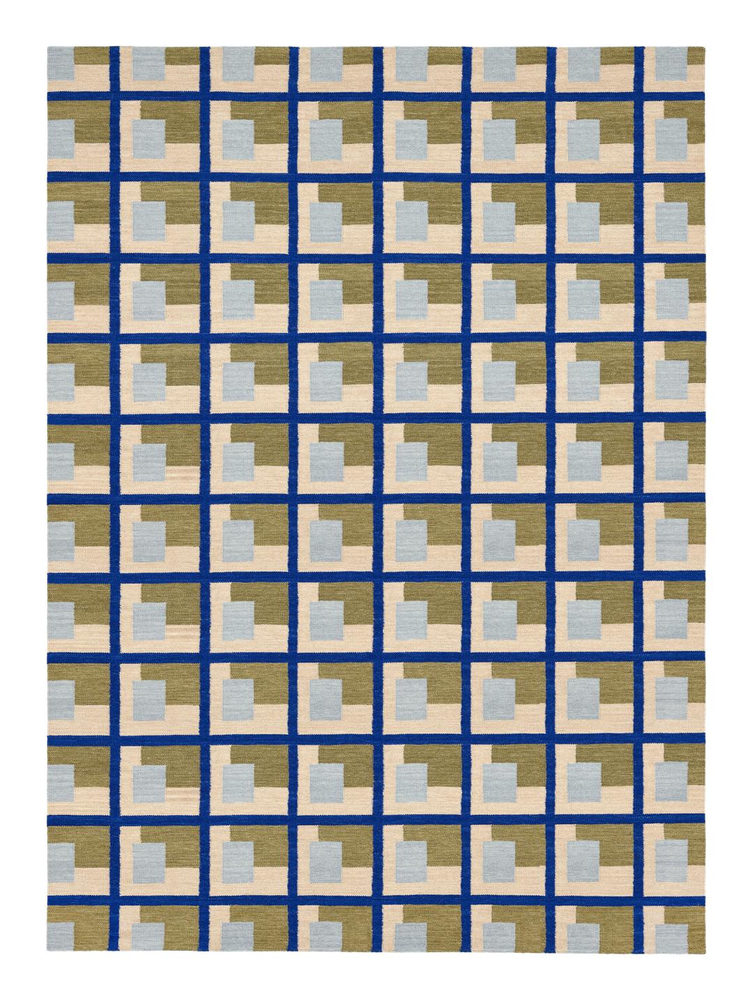 Een handgeweven groen vloerkleed met een geometrisch rasterpatroon