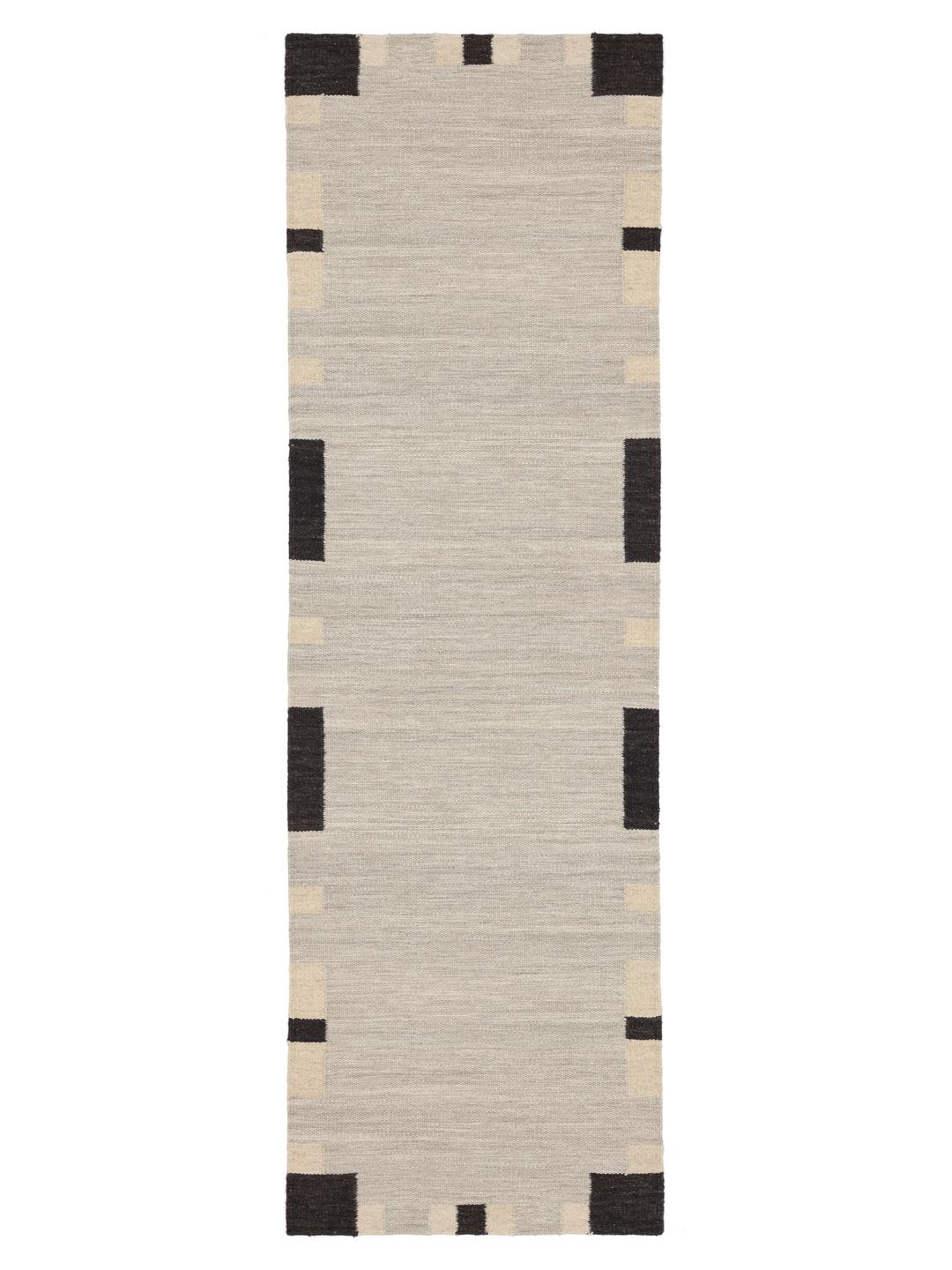 Beige en zwarte loper tapijt met een geometrische rand