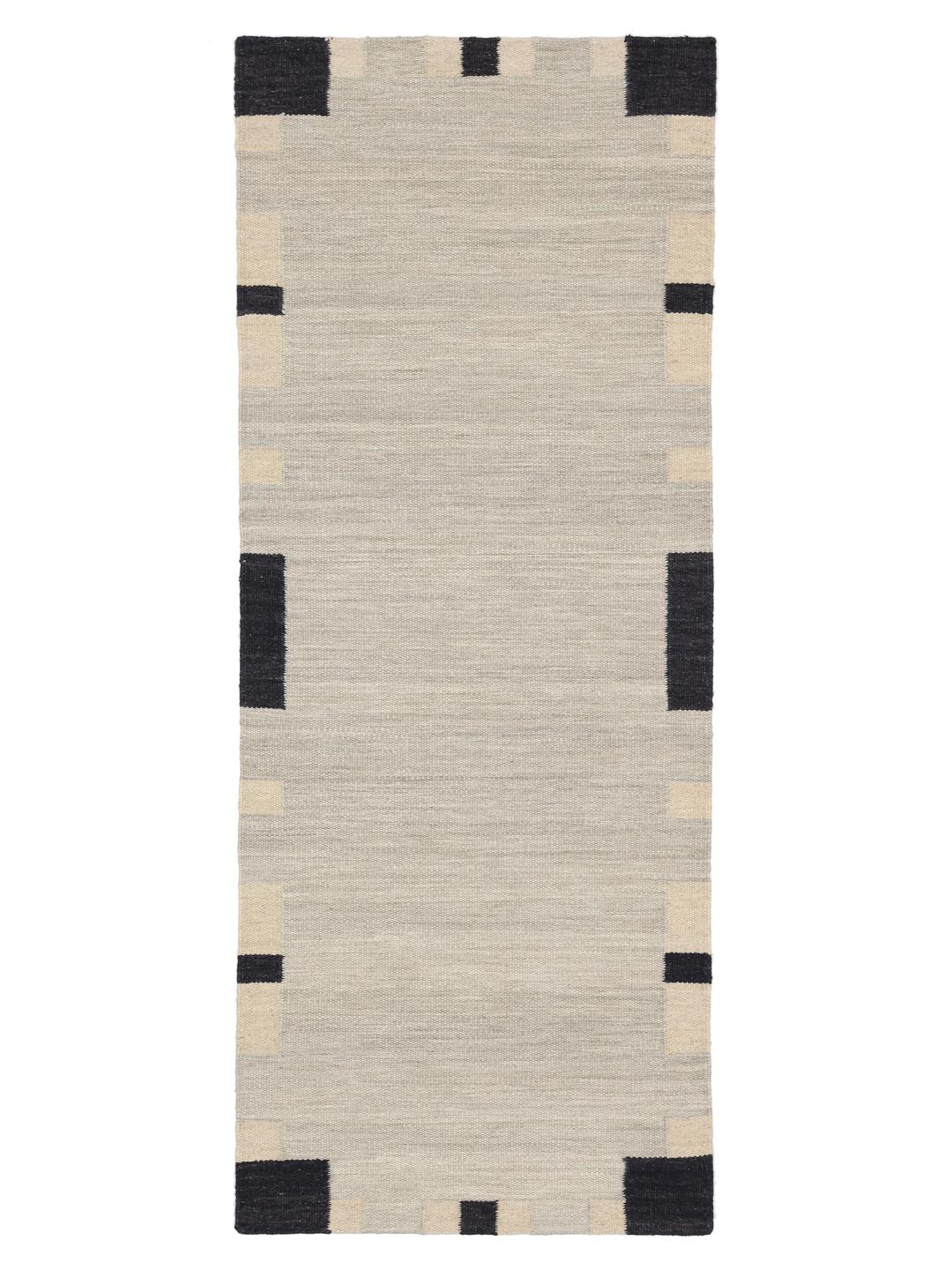 Beige en zwarte loper tapijt met een geometrische rand