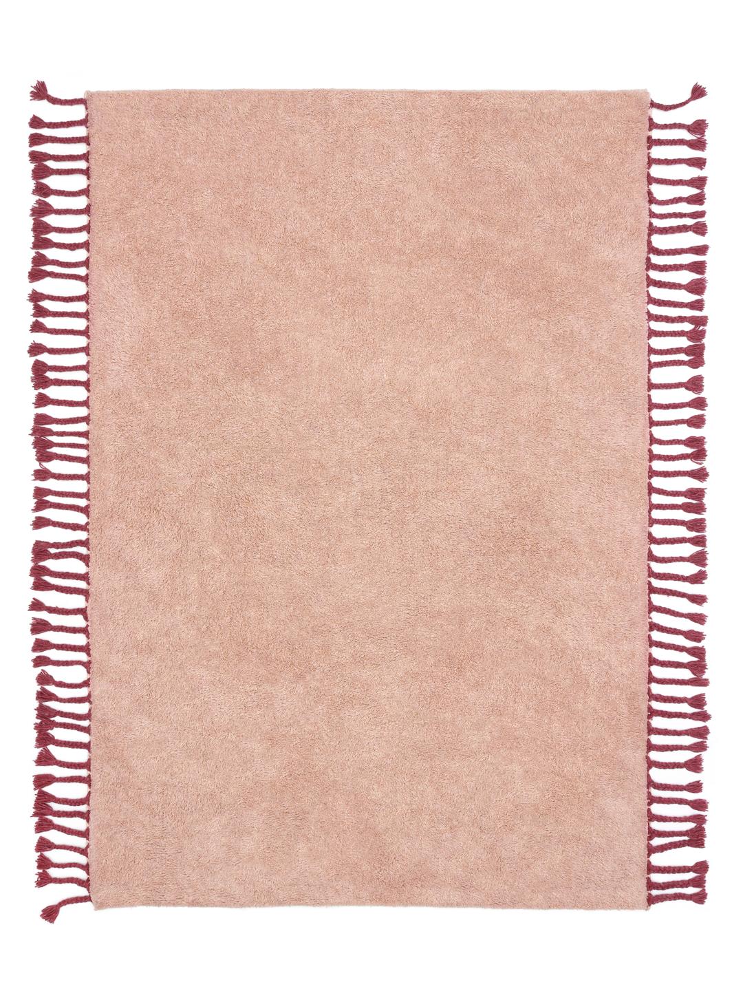 Roze vloerkleed met franjedetails