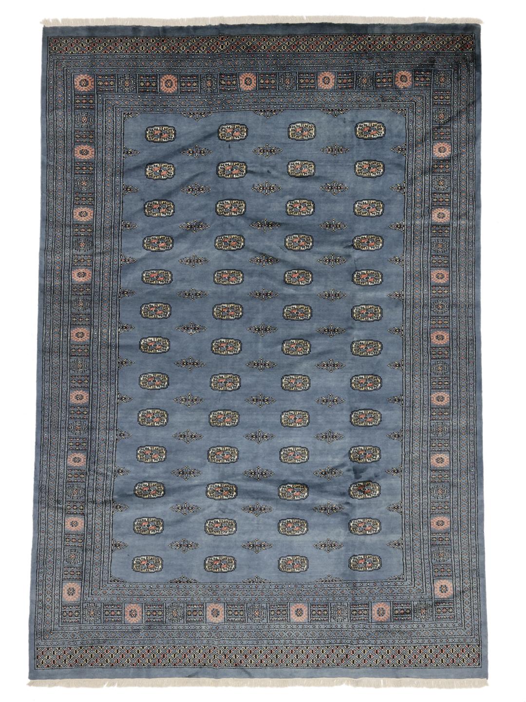Hand-knotted blue Pakistani Bokhara rug with traditional gul motifs
