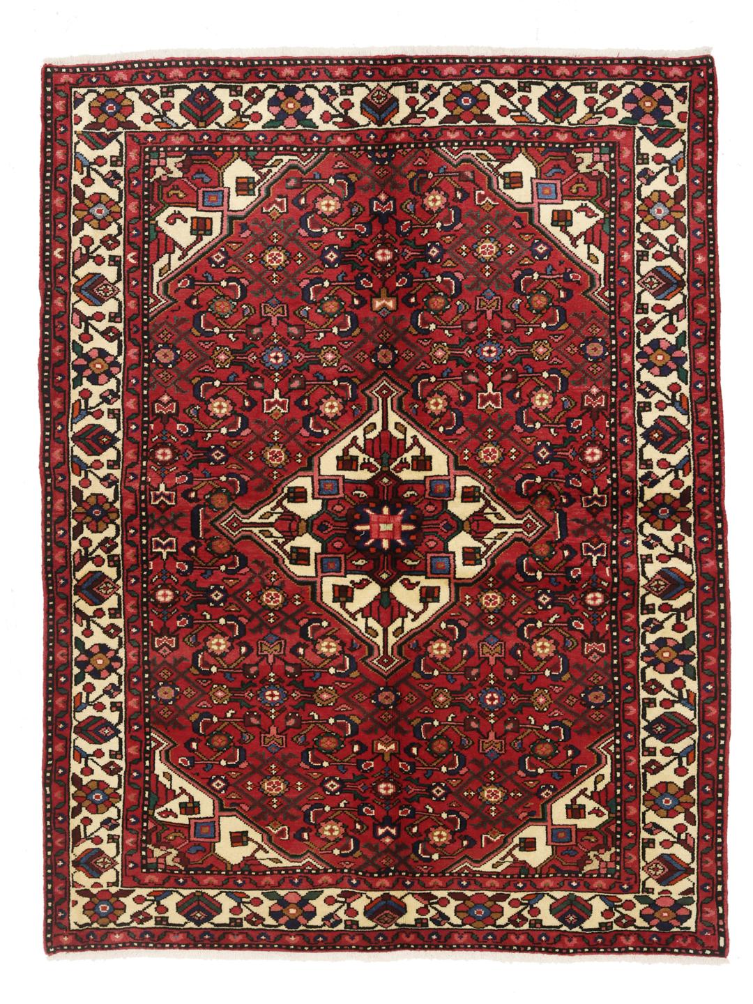 Hand-knotted Hosseinabad rug from the Middle East featuring a red field and a classic medallion pattern.