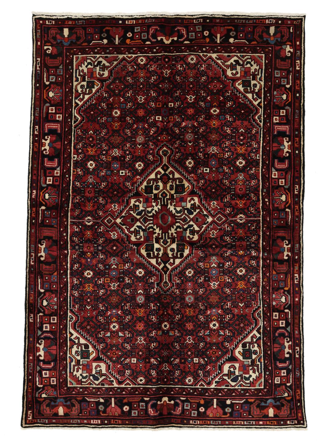 Hand-knotted Hosseinabad rug with a dark-red field and traditional geometric motifs