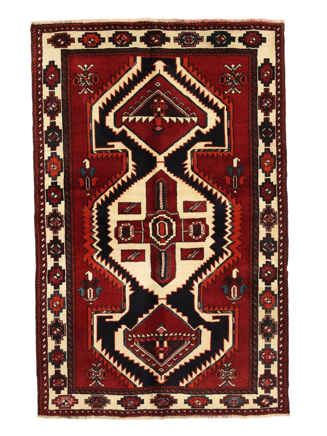 A hand-knotted Lori rug from the Middle East featuring a vibrant red and black geometric medallion design.