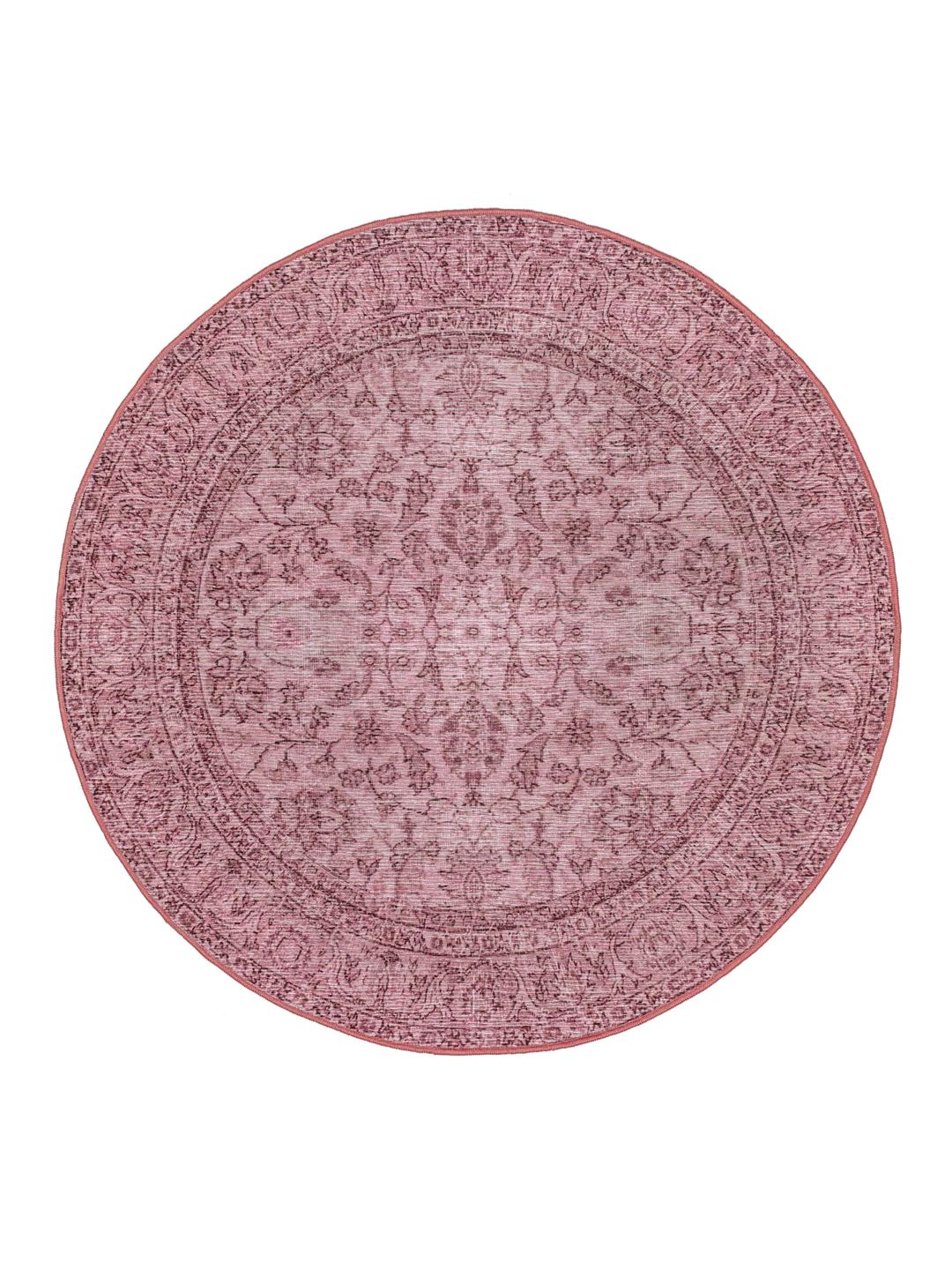 Rond roze vloerkleed met een klassiek patroon