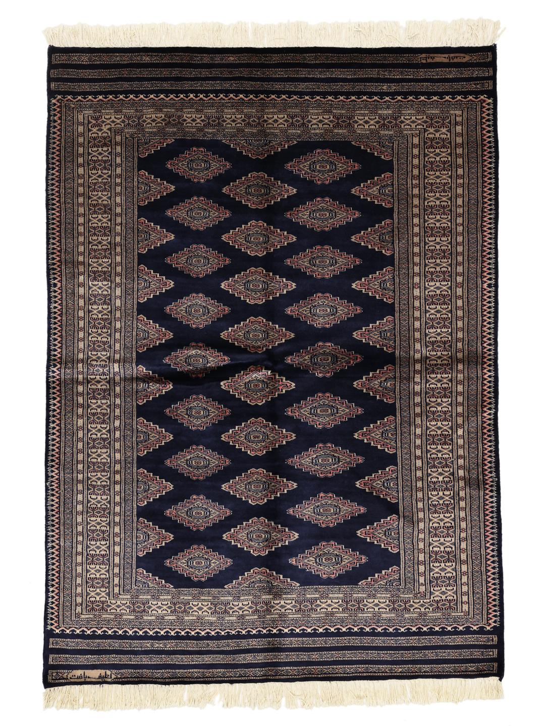 Hand-knotted Pakistan rug with deep blue field and geometric motifs