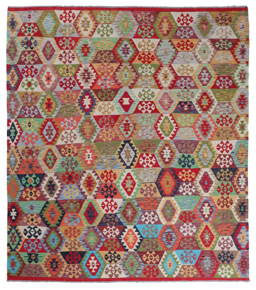 A large rectangular Afghan Kelim rug featuring a vibrant multicolor geometric pattern