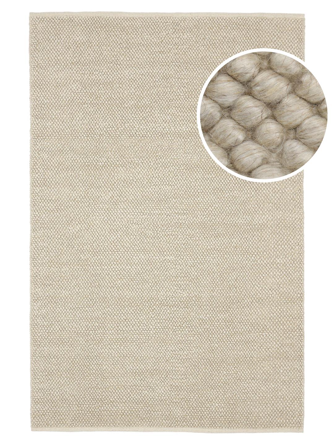 Beige wollen vloerkleed met gestructureerd oppervlak