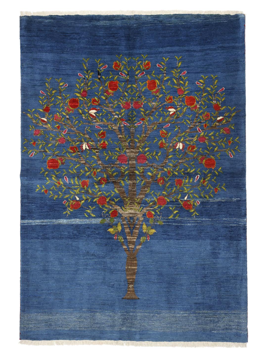 A hand-knotted Loribaft rug from the Middle East featuring a Tree of Life design on a blue field.