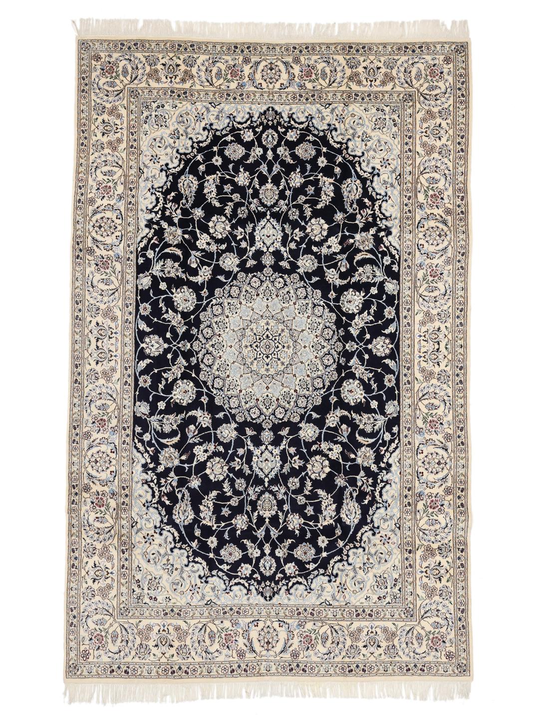 A hand-knotted Nain rug from the Middle East featuring a black field with light floral patterns.