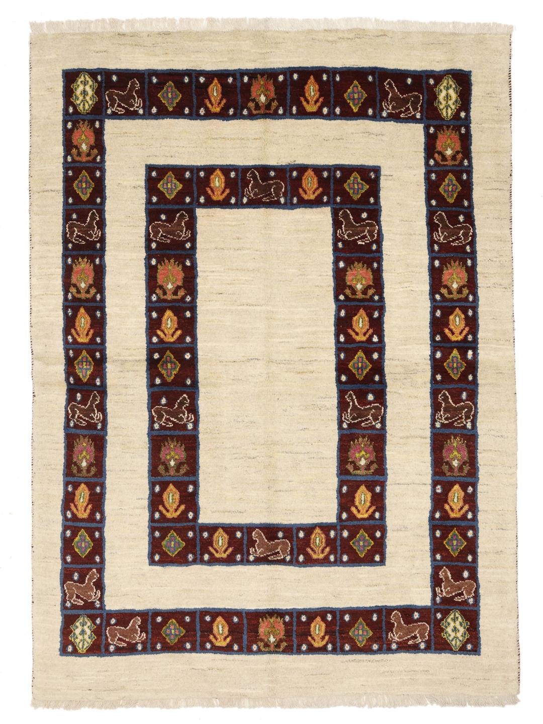 A hand-knotted Middle Eastern Shabargan rug in beige with dark red and blue accents.
