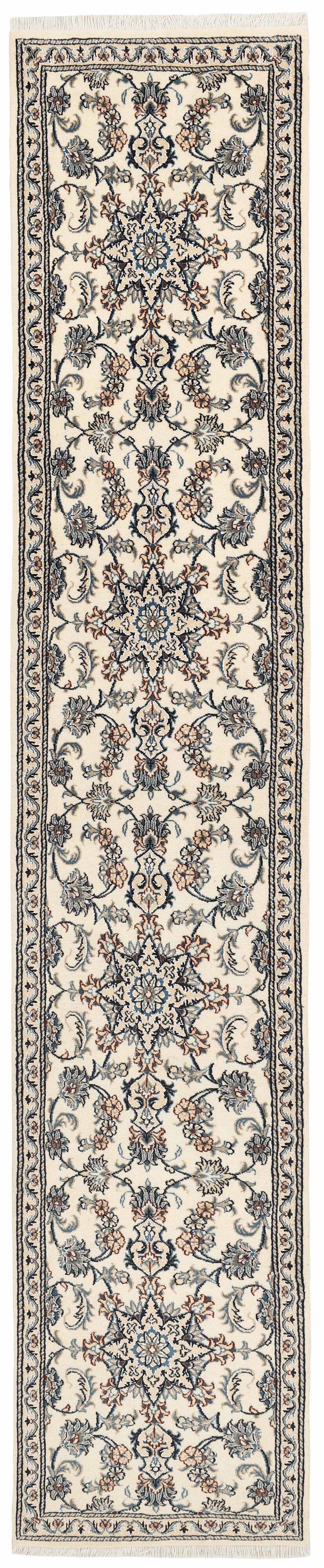 Hand-knotted Nain runner with a beige field and floral motifs in blue and earth tones