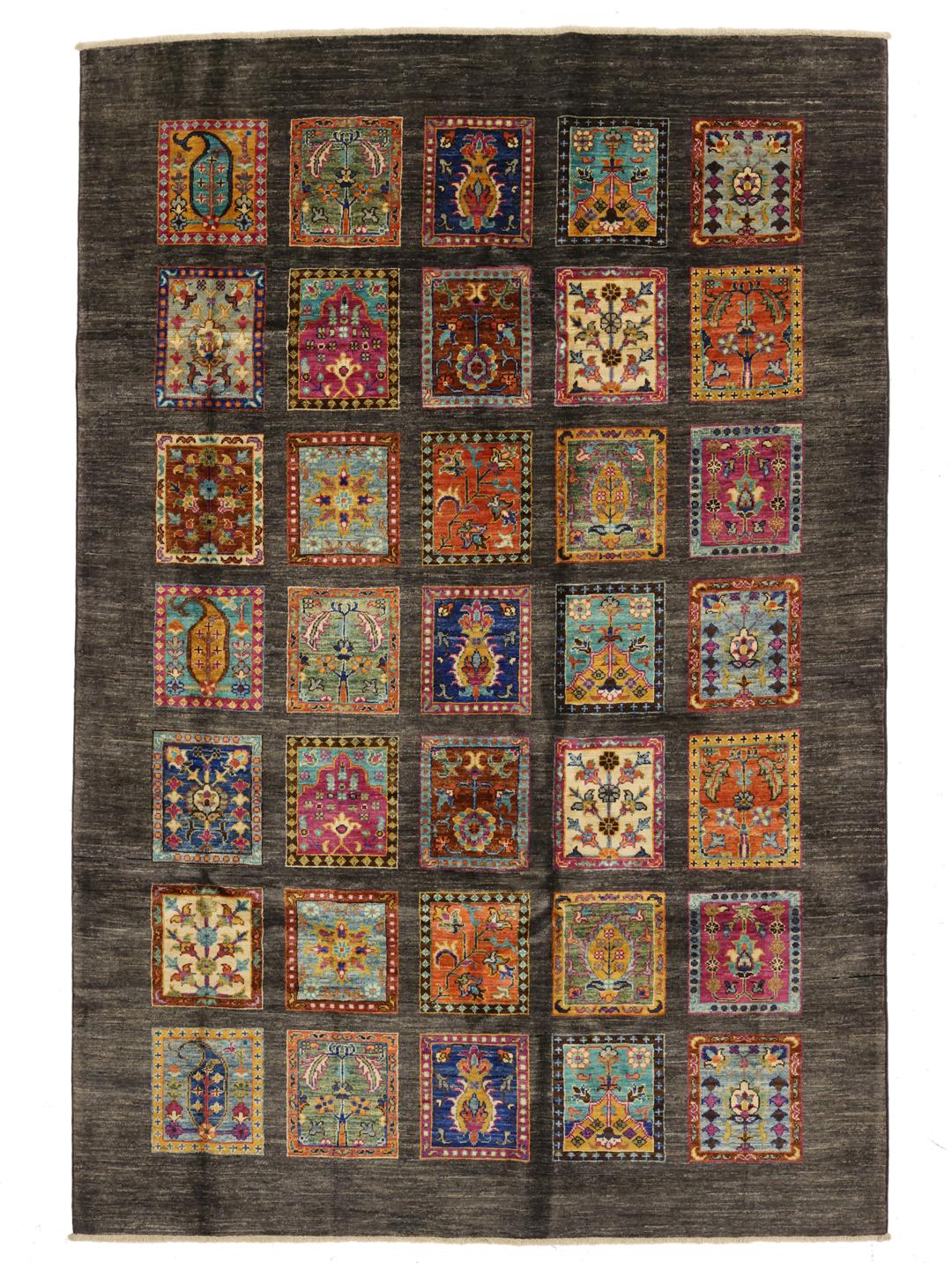Hand-knotted rug from the Middle East featuring a dark field with colourful decorative panels.