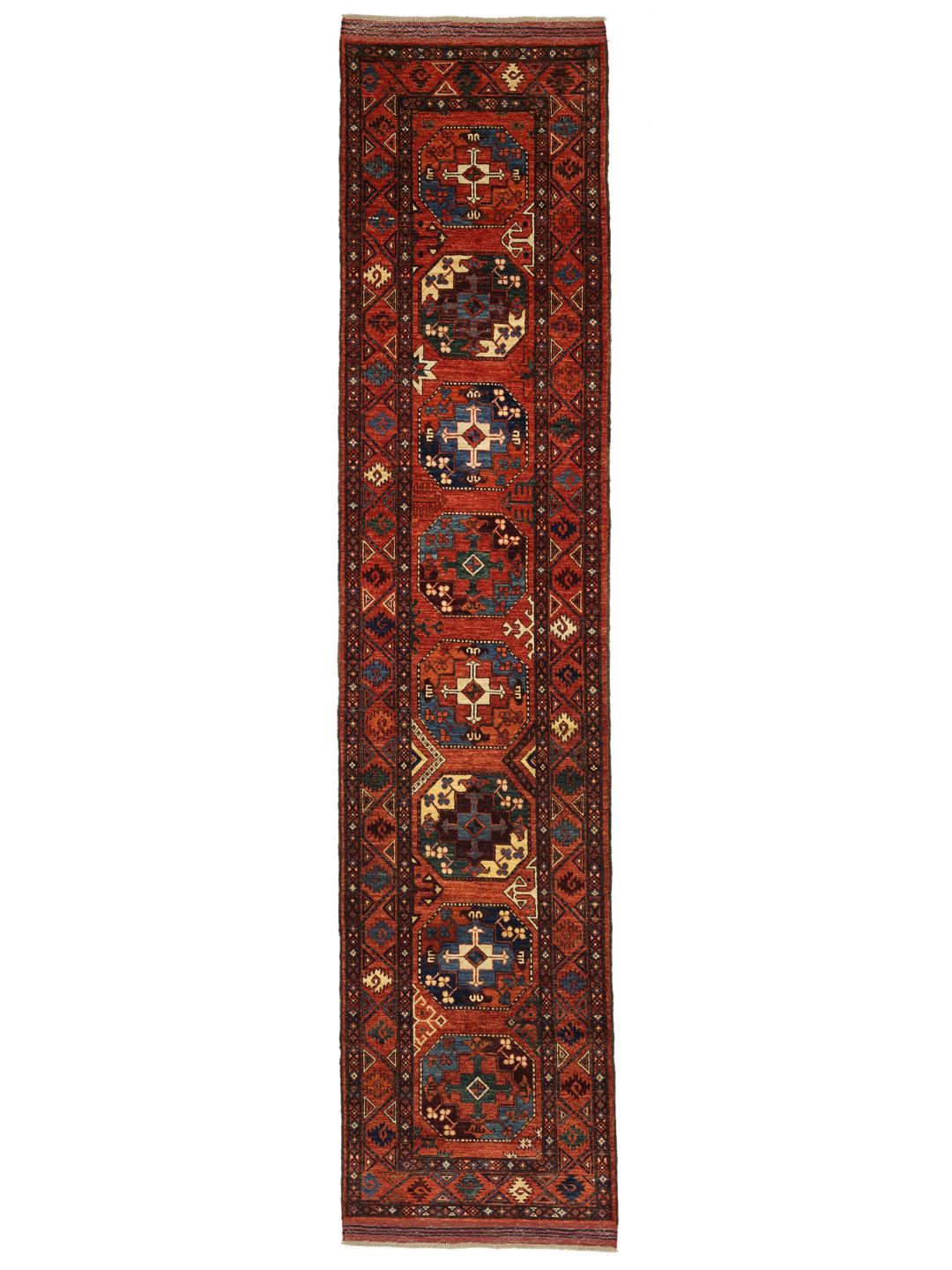 Hand-knotted Panjshir wool runner from the Middle East in red tones.
