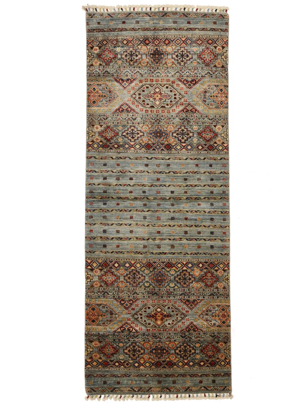 Hand-knotted runner from Afghanistan with blue and red geometric patterns.