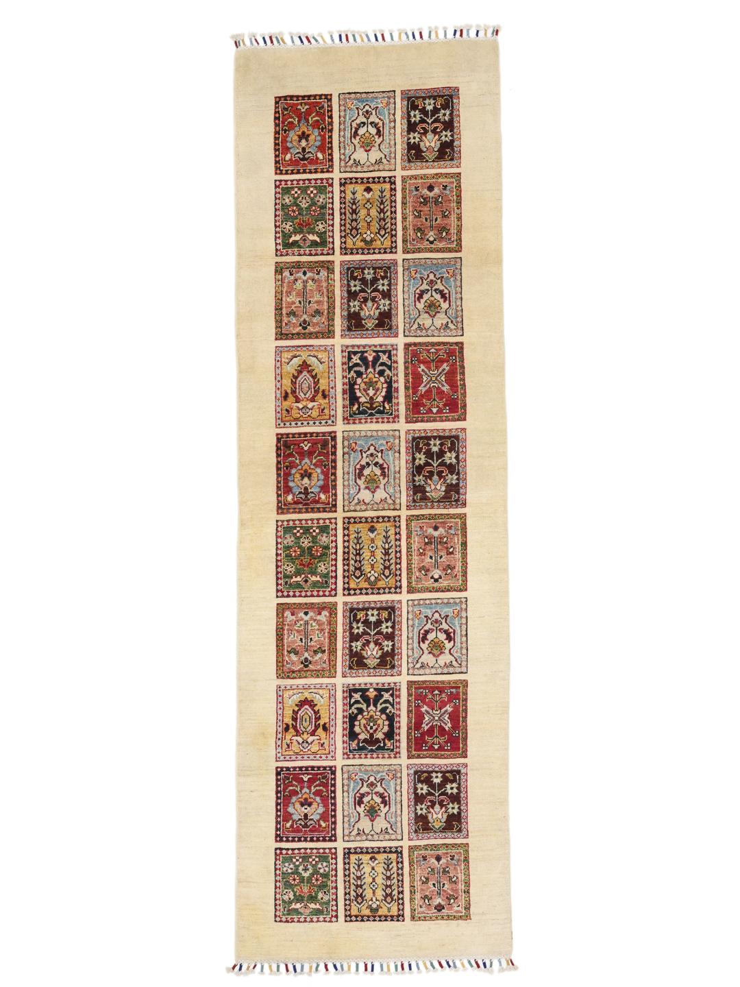 Hand-knotted Afghan runner with colourful floral grid panels on a beige background.